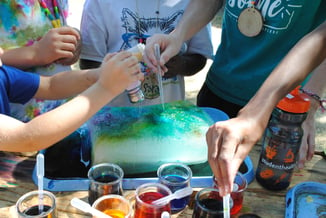 Hands painting as participation in art workshop