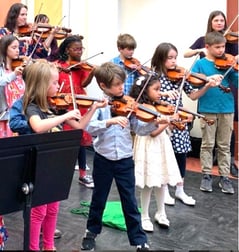 Kids playing violin at Vesper School of Music