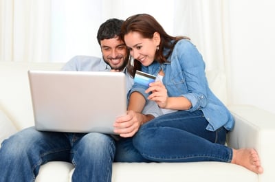 young-couple-online-shopping-with-credit-card-and-computer-000050647786_Small